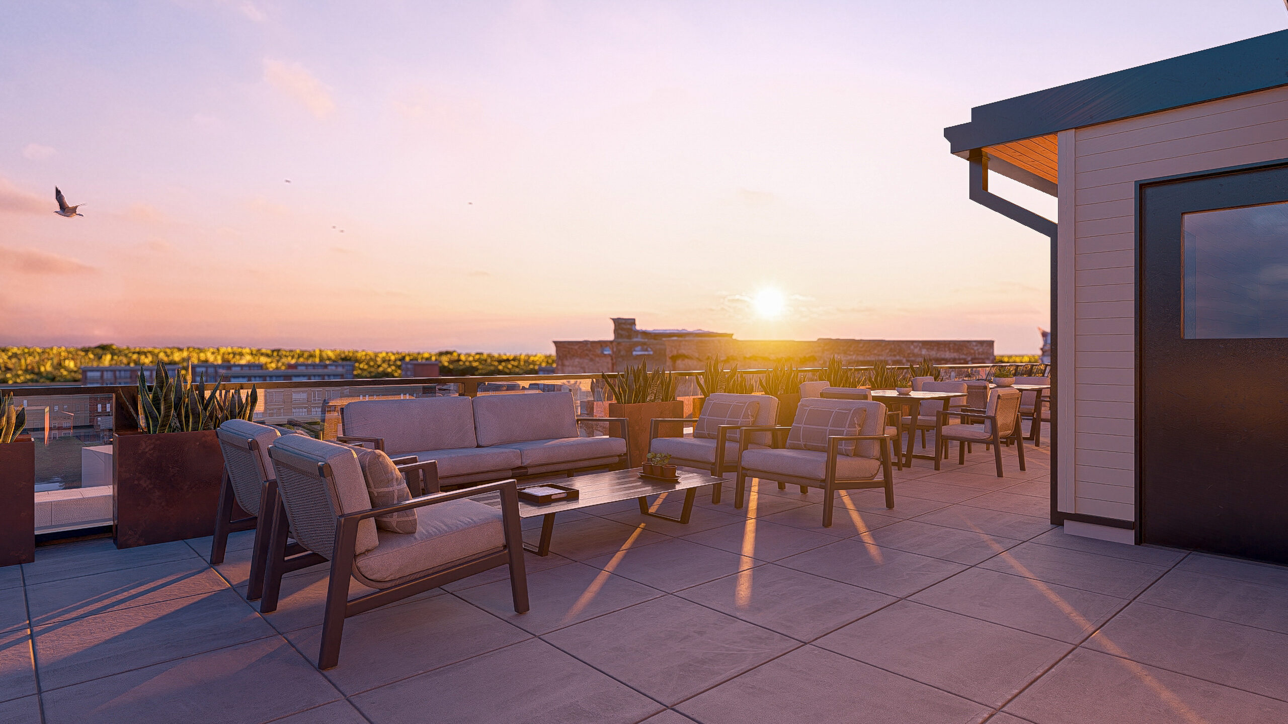 rooftop bar with barstools and sunset