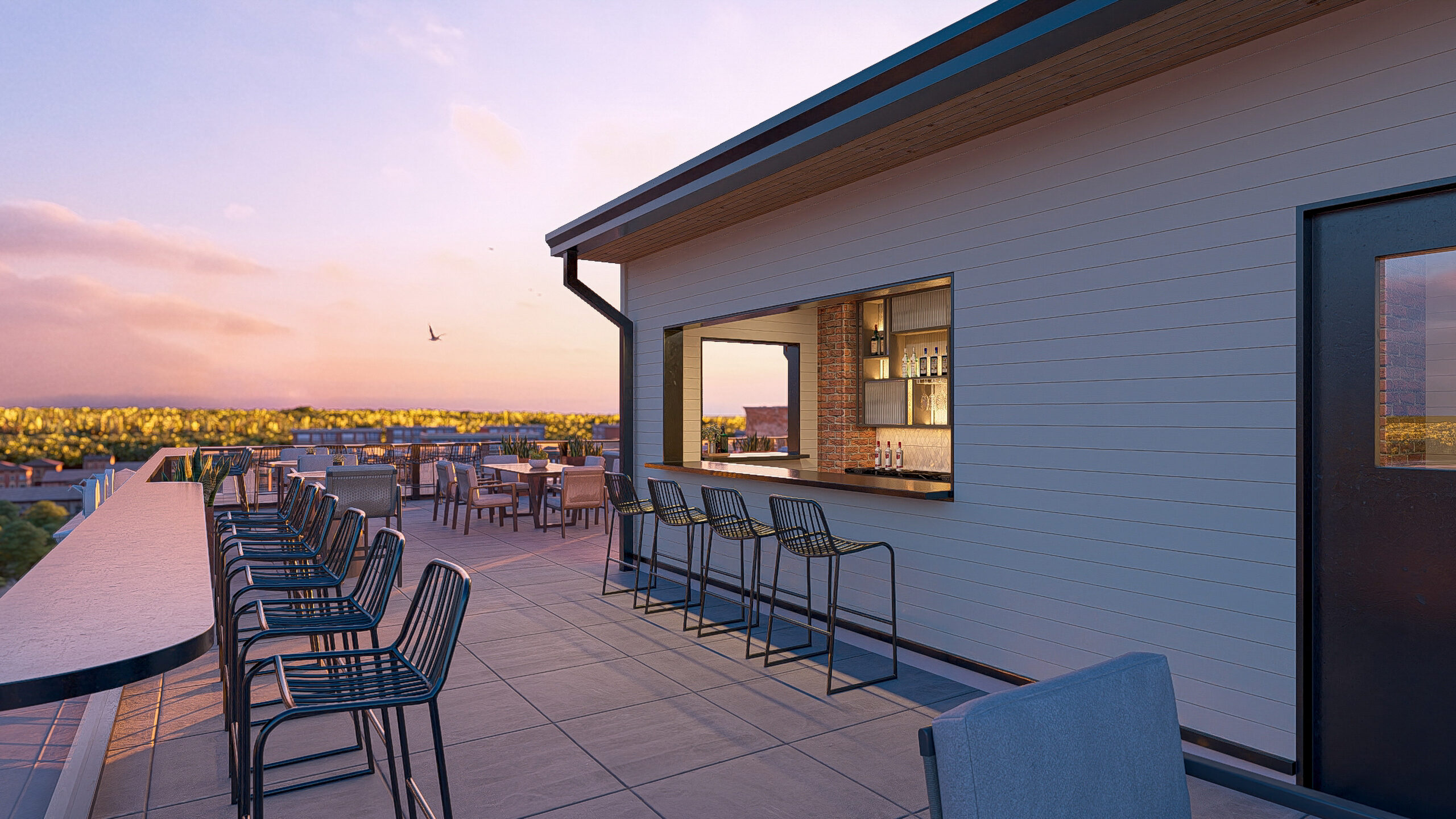 rooftop bar with barstools and sunset