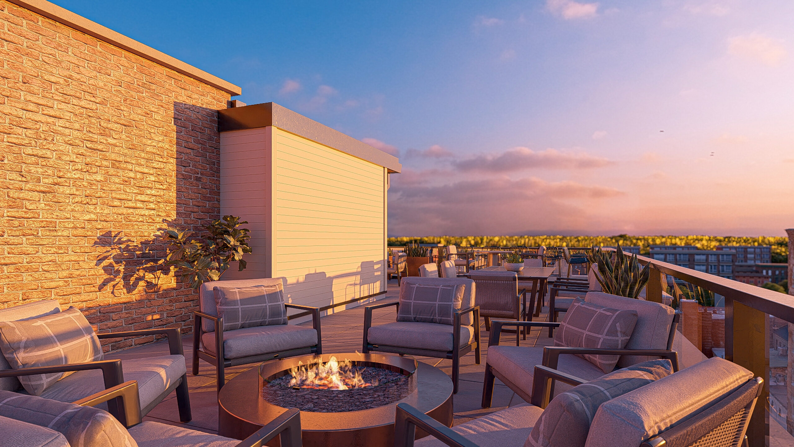 fire pit and chairs on rooftop with sunset in background