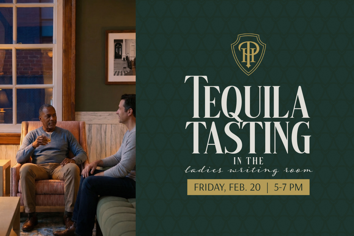 two men sipping tequila sitting in chair and on sofa. Dusk lighting